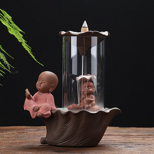Little Monk Sitting by the Glass Smoke Backflow Incense Burner