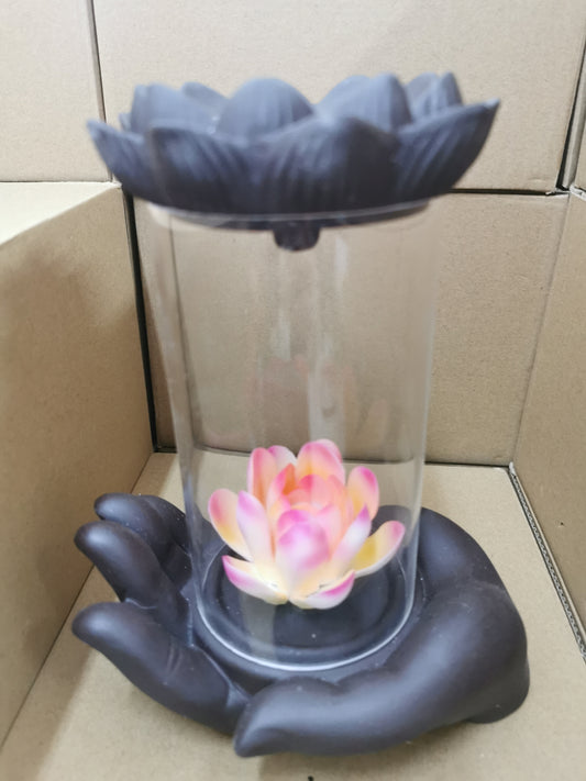Holding Delicate Flower in a Glass Smoke Backflow Incense Burner