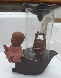 Little Monk Sitting by the Glass Smoke Backflow Incense Burner